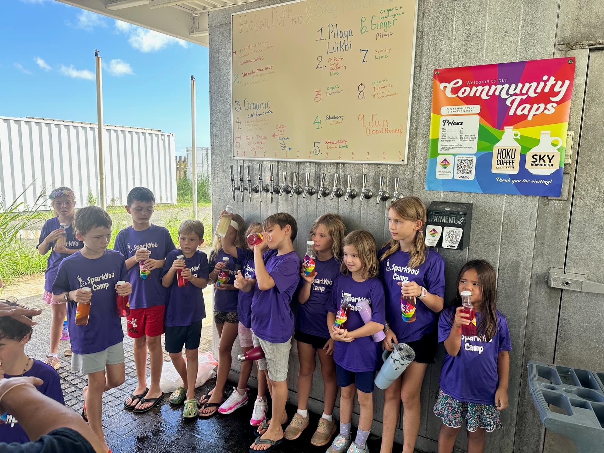 Kids from the local community at the Waimānalo tap wall